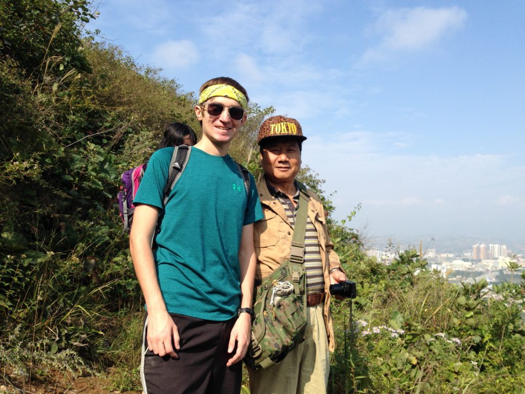 2 men looking at camera on hike peace corps